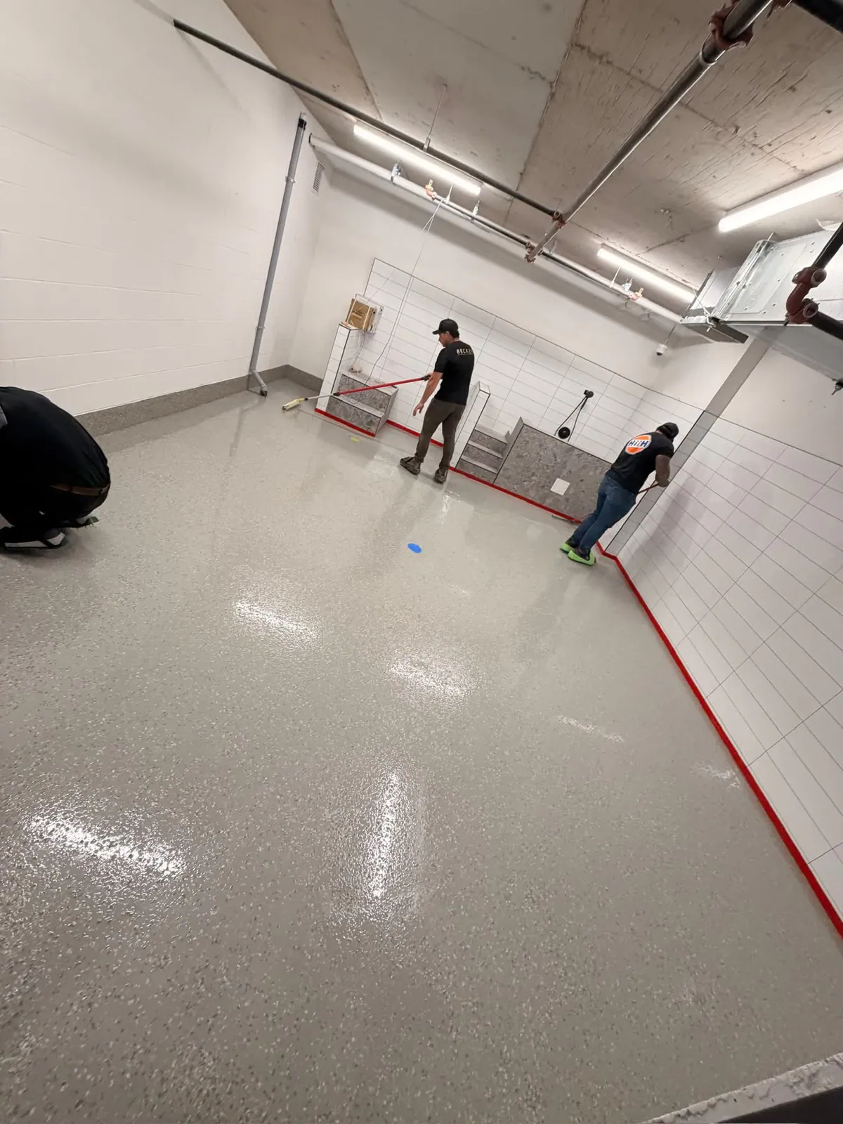 Becker Flooring applying an epoxy floor coating