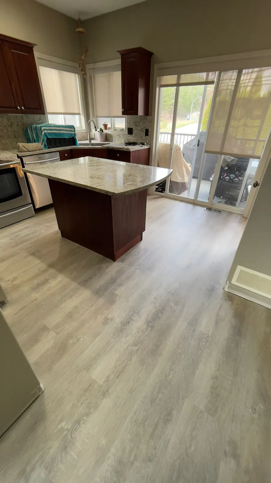Hardwood flooring in a bright kitchen with island