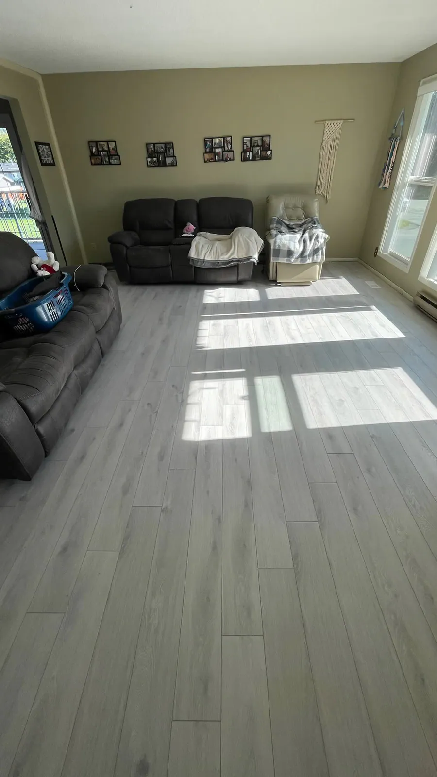 Finished grey luxury vinyl plank living room